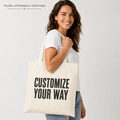Adult model carrying a Customize Your Way tote bag
